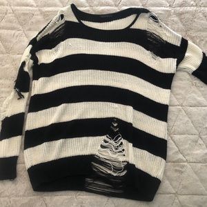 Distressed black and white sweater